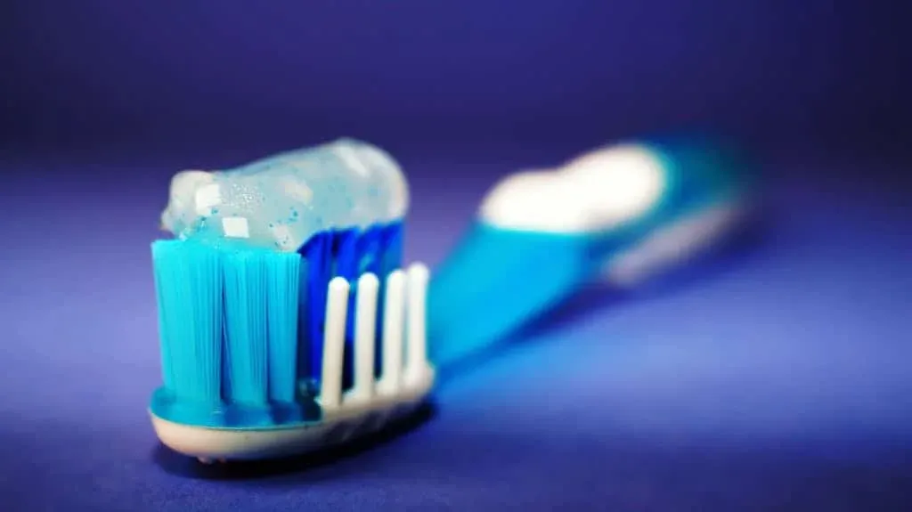 A tooth brush with toothpaste applied