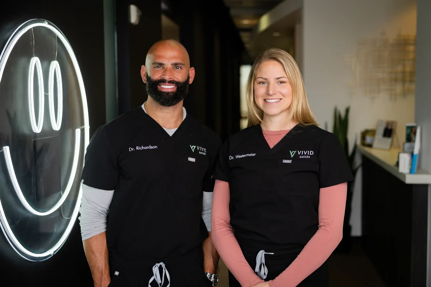 Dr. Bryce Richardson and Dr. Annelise Westermeier in the Vivid Smiles hallway