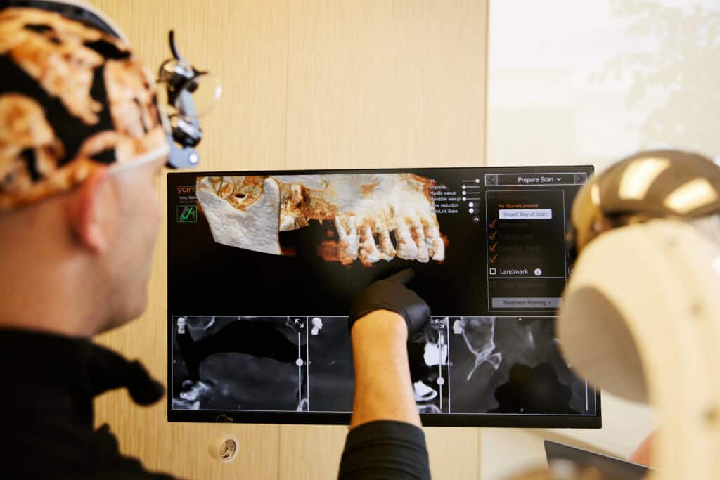 Dr Bryce Richardson examining a 3D scan of a patients mouth