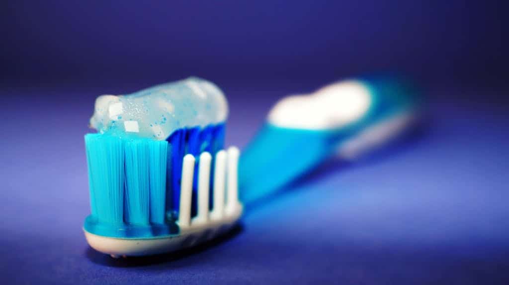A tooth brush with toothpaste applied