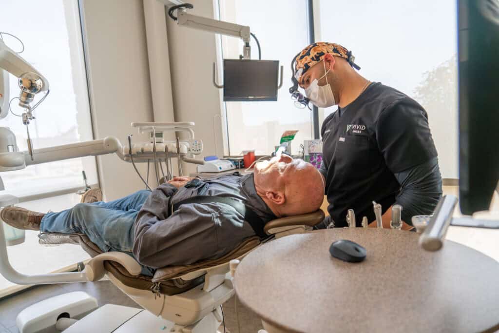 Dr Richardson examining a patient during a checkup