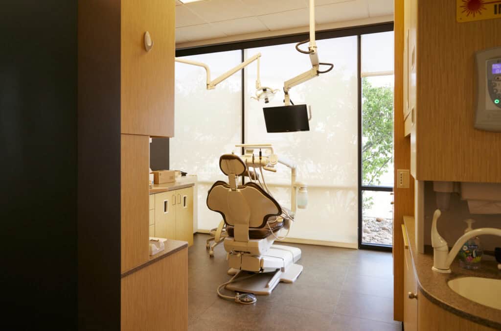 A dental chair within one of vivid smiles dentistry clinical rooms.