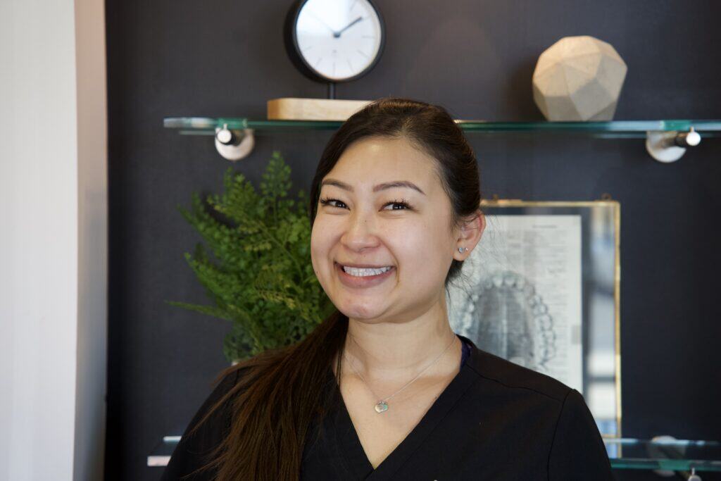 A member of the staff smiling