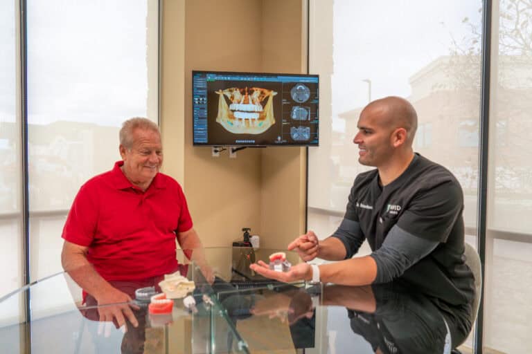 Dr Richardson explaining the implant process to a patient