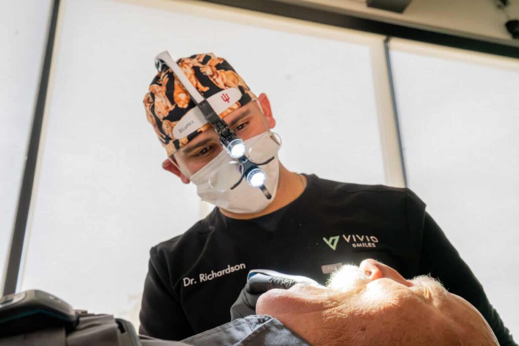 Dr Bryce Richardson preforming a dental implant consult