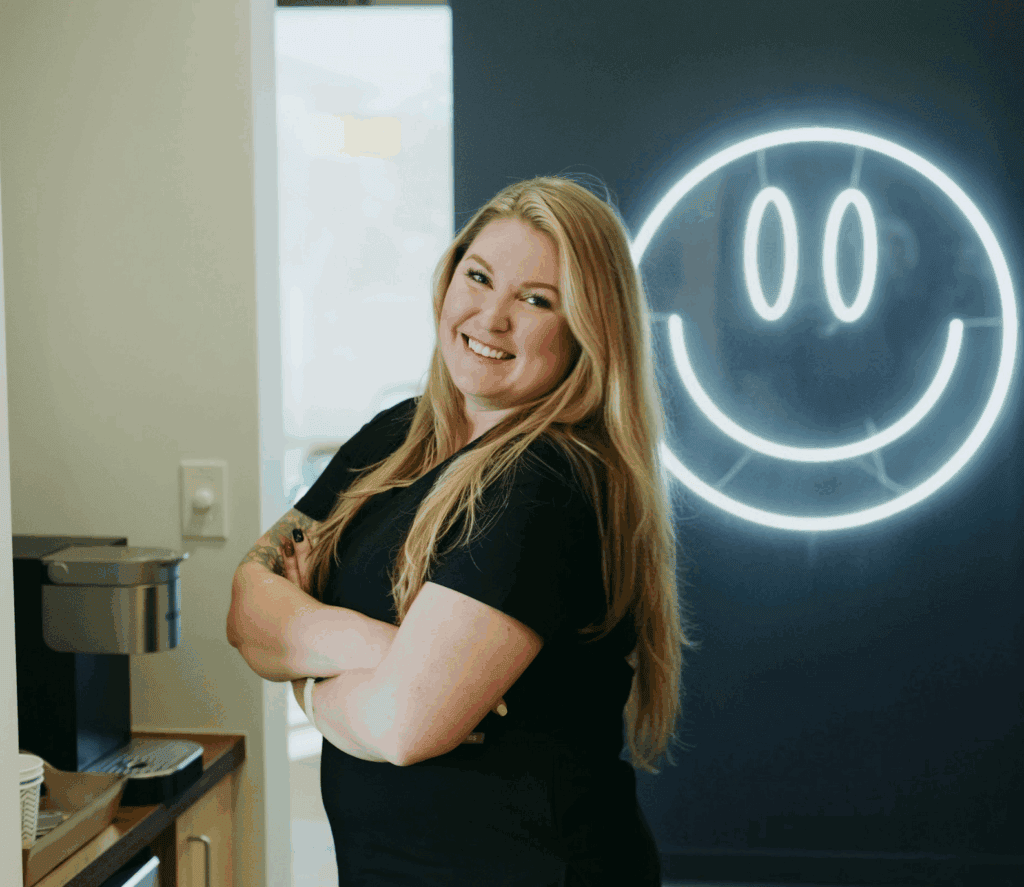 A member of the staff smiling