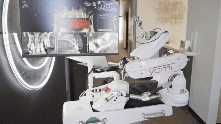 Yomi Dental Equipment displayed in front of a vivid smile logo