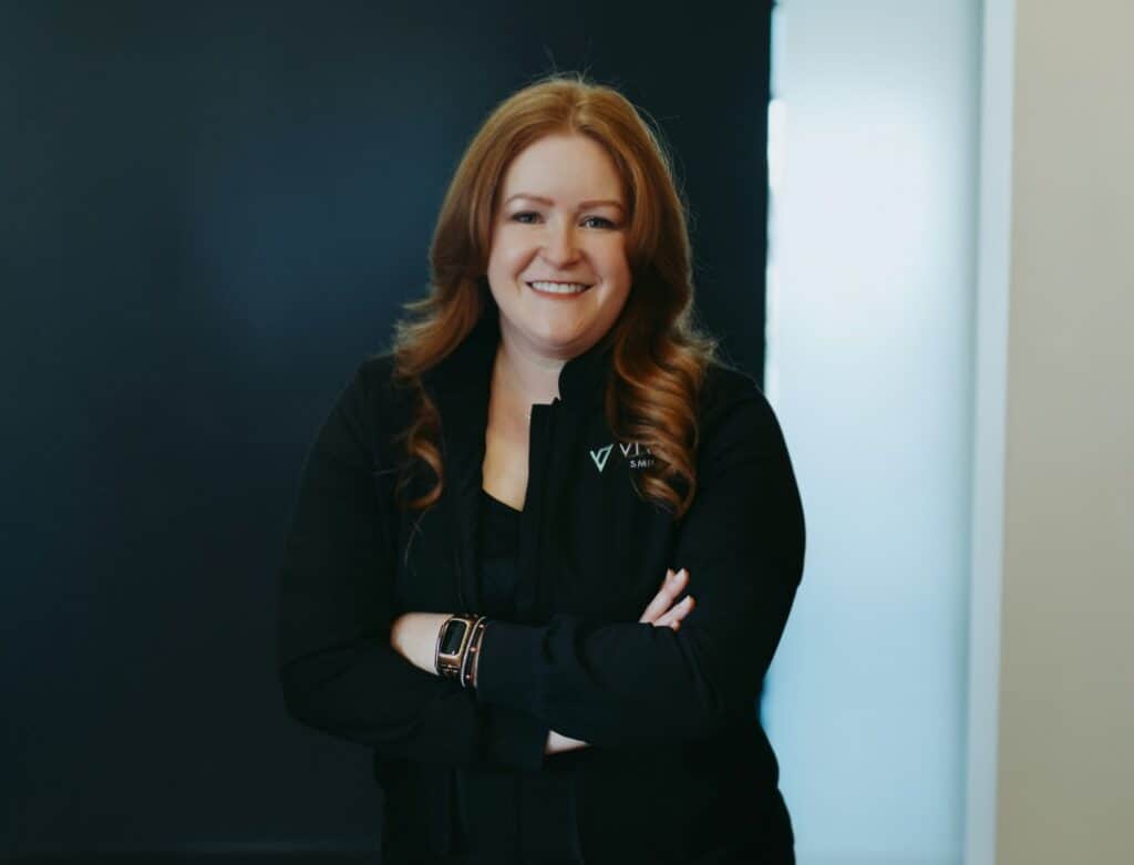 A member of the staff smiling