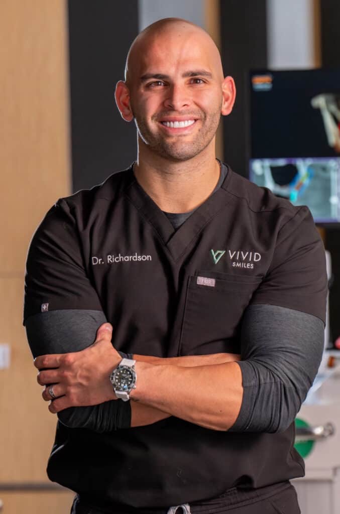 Portrait image of Dr. Bryce Richardson standing in the Vivid Smiles Dentistry waiting room in Parker, CO